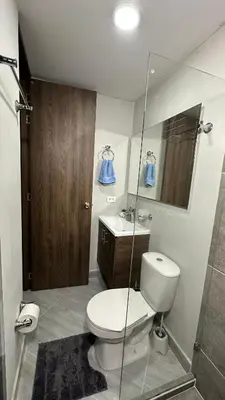 a bathroom with a toilet and a sink and a shower at Apto estudio moderno en Sabaneta Ideal para pareja in Sabaneta