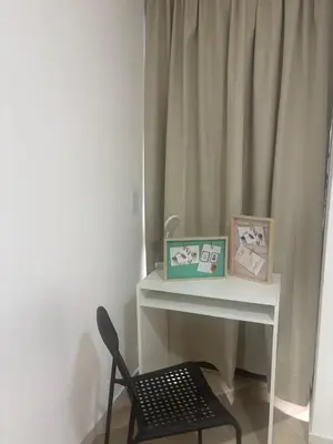 a chair sitting next to a table with a mirror at EstadioMedellin in Medellín