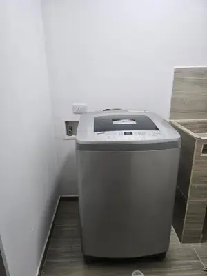 a trash can sitting in the corner of a room at EstadioMedellin in Medellín