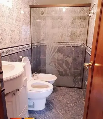 a bathroom with a toilet and a sink and a shower at Finca Villa Palma in Barbosa