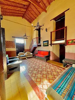 a large living room with a couch and a staircase at Casa Real - Encanto Colonial in Sopetran
