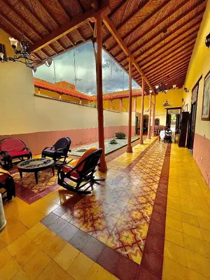 a lobby with chairs and a table in a building at Casa Real - Encanto Colonial in Sopetran