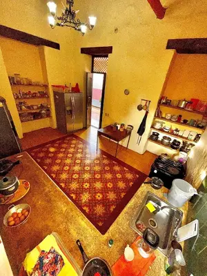 an aerial view of a kitchen with a counter top at Casa Real - Encanto Colonial in Sopetran