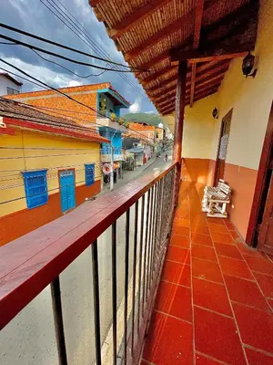 a balcony of a building with a view of a street at Casa Real - Encanto Colonial in Sopetran
