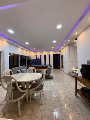 a living room with a table and a pool table at Villa de lujo con piscina, jacuzzi y vista maravillosa in El Peñol
