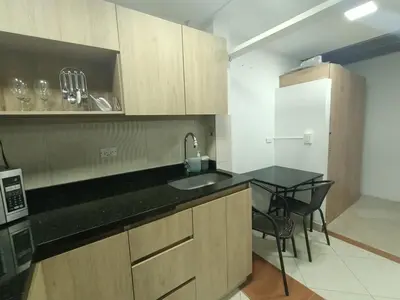 a kitchen with a sink and a black counter top at Aparta Hotel Campestre para 5H Poblado San Lucas apt 112 in Medellín