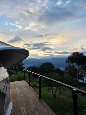 a wooden deck with a view of the mountains at Deluxe Glamping Domo in Copacabana
