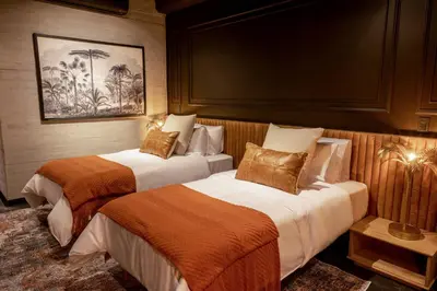 a hotel room with two beds in a room at The Host Medellin Adults Only in Medellín