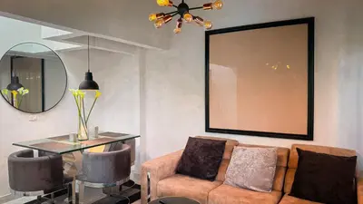 a living room with a couch and a table at Urban Lofts Laureles 40 in Medellín
