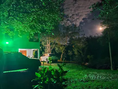 a car parked in a yard at night at Don tranquilo in Alejandría
