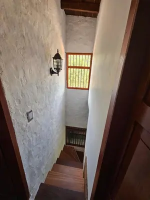 a stairway with a light and a window at Don tranquilo in Alejandría