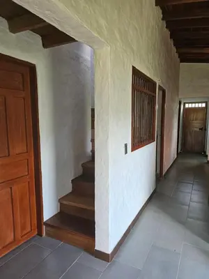 a hallway of a house with stairs and a door at Don tranquilo in Alejandría
