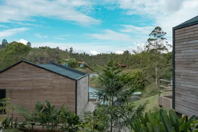 a house with a view of a river at Okai by Bernalo Hotels in Guatapé