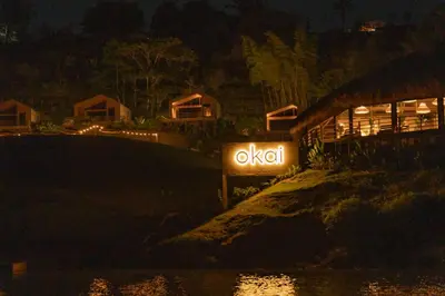 a sign that says oxo at night at Okai by Bernalo Hotels in Guatapé