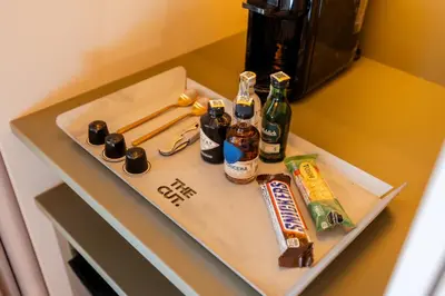 a table with beer bottles and chopsticks on it at The Cut Hotel in Medellín