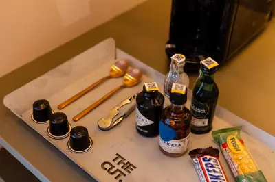 a box with bottles of beer and baseball bats at The Cut Hotel in Medellín