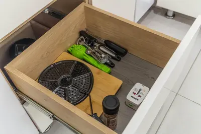 a wooden drawer with some tools in it at Coffee Spring Studio Medellin in Medellín