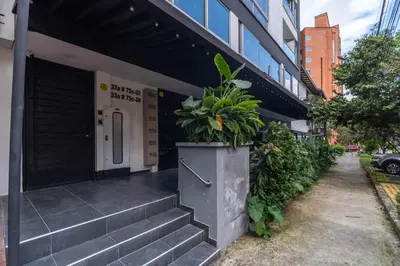 a building with a potted plant on the side of it at Coffee Spring Studio Medellin in Medellín