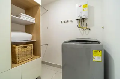 a bathroom with a trash can in a room at Coffee Spring Studio Medellin in Medellín