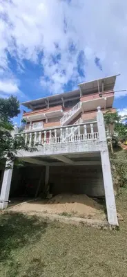 a large building with a building underneath it at La Morada Del Gavilucho in San Carlos