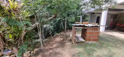 a brick fireplace in the yard of a house at La Morada Del Gavilucho in San Carlos