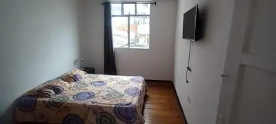 a small bedroom with a bed and a window at habitaciones amobladas la estrella in Manizales
