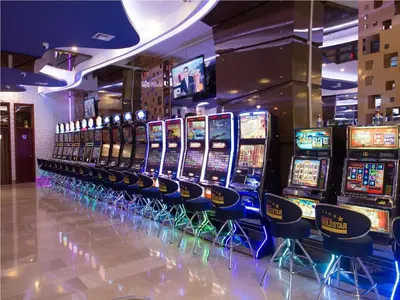 a row of slot machines in a casino at Hotel Dorado La 70 in Medellín