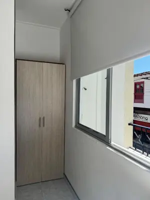 a room with a wooden door and a window at Hotel Café de la Montaña in Pensilvania