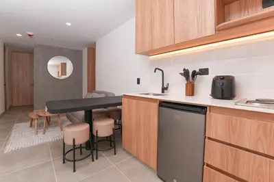 a kitchen with a sink and a counter top at Metropolitan Living by HOUSY in Medellín