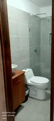 a bathroom with a toilet and a sink and a shower at Apartamento completo in Jardin