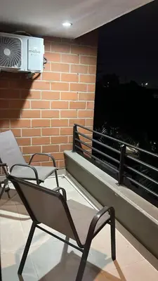 a chair sitting on a balcony with a heater at Mirador pueblito Paisa-Tipo loft in Medellín