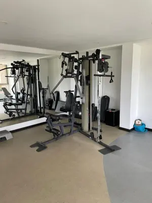 a gym with several tread machines in a room at Suite Casa Grande in Rionegro