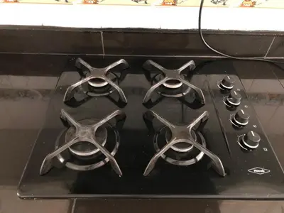 a stove top with four burners on it at Casa campestre con piscina, jacuzzi y bbq in La Dorada