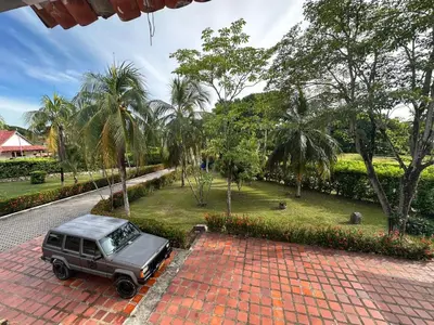 a jeep parked on a brick driveway in a park at Casa campestre con piscina, jacuzzi y bbq in La Dorada