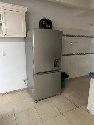 a stainless steel refrigerator in a kitchen at Casa campestre con piscina, jacuzzi y bbq in La Dorada