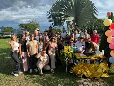 a group of people posing for a picture at a party at Finca turística Villa Carolina in Sabaletas