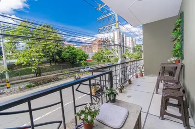 a balcony with a view of a city at Hostal Bendito, central y cómodo in Medellín