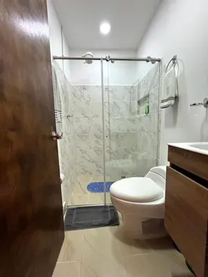 a bathroom with a shower and a toilet and a sink at Elegante lugar a pasos del metro in Medellín