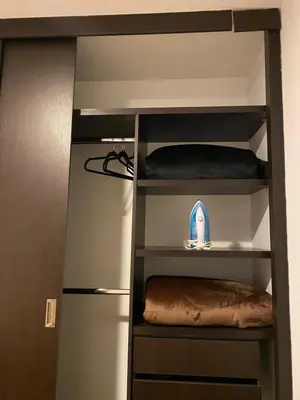 a book shelf with a bed in a room at Central, Universidades y Centro Comercial in Manizales