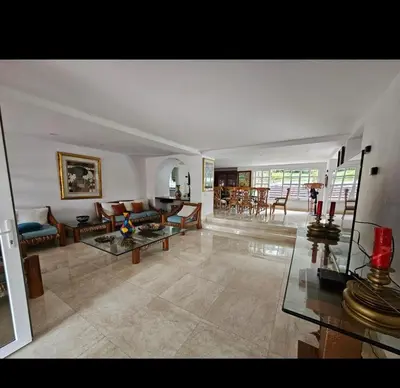 a large living room with couches and a table at Casa de campo El Jaguar in San Jerónimo