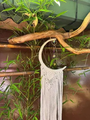 a dream catcher made out of rope and antlers at Bosque Encantado Story in Medellín