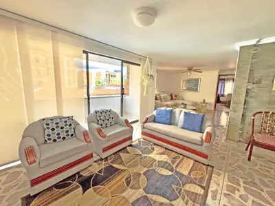 a living room with two chairs and a couch at Apartamento Stay Medellín Laureles in Medellín