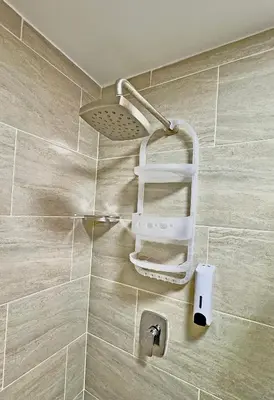 a shower with a towel holder in a bathroom at Apartamento Stay Medellín Laureles in Medellín