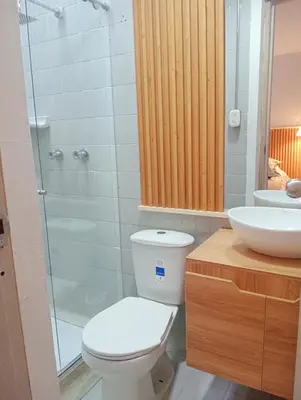 a bathroom with a toilet and a sink and a shower at Casa Frailejón Manizales in Manizales
