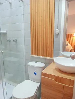 a bathroom with a toilet and a sink and a shower at Casa Frailejón Manizales in Manizales