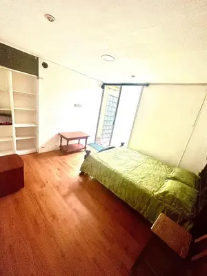 a bedroom with a bed in a room with a window at Apartamento en Belén la palma medellin in Medellín