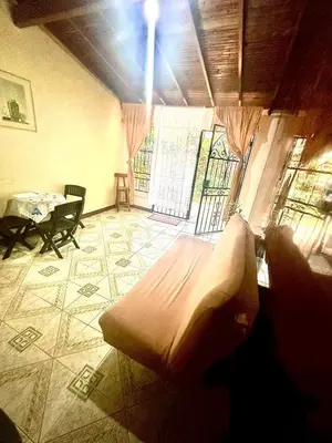 a room with a bed and a table in it at Apartamento en Belén la palma medellin in Medellín