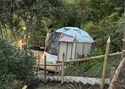 a gazebo with a tent in a garden at Glamping in Titiribi in Titiribí