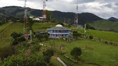 an aerial view of a house on a hill at Bed and bath at Villacarolina in Titiribí