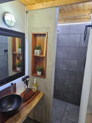 a bathroom with a sink and a shower at Cozy, Convenient and Affordable Loft In Laureles in Medellín